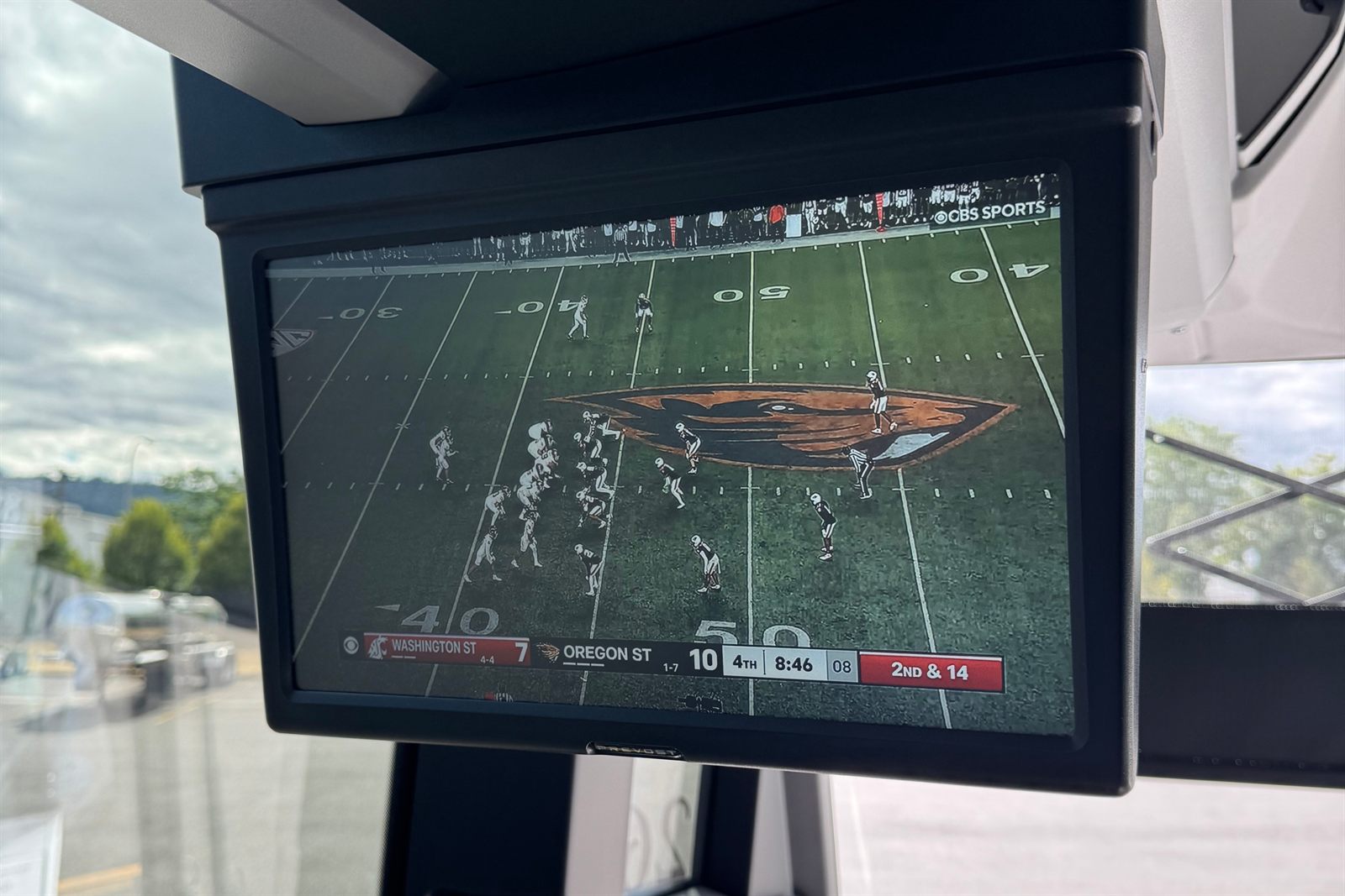 On-board TVs showing the Oregon State game